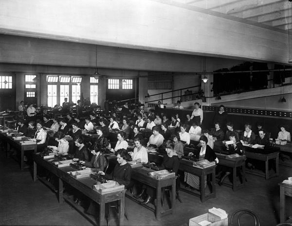 A room full of human computers in the early 1900s — rows of workers manually processing calculations before the spreadsheet existed
